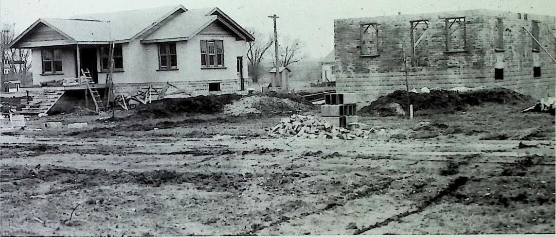 Figure 14: Stockade Building System, Inc., Stockade House and House under Construction, ca. 1926.
